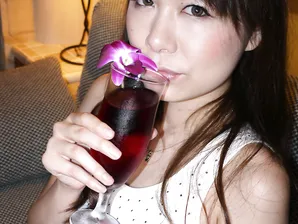 Asian beauty Miharu Kai exposes her natural tits in a tipsy bedroom striptease