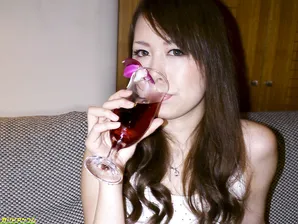 Asian beauty Miharu Kai exposes her natural tits in a tipsy bedroom striptease