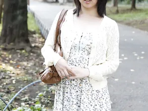 Japanese girl Madoka Adachi shows her bare legs during non-nude outdoor action