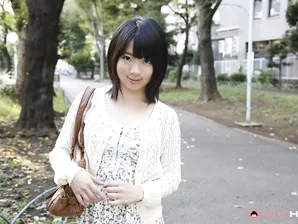 Japanese girl Madoka Adachi shows her bare legs during non-nude outdoor action