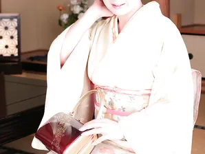 Japanese lady Ayano Murasaki receives a facial while posing in her lingerie