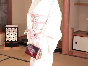 Japanese lady Ayano Murasaki receives a facial while posing in her lingerie