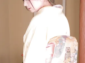 Japanese lady Ayano Murasaki receives a facial while posing in her lingerie