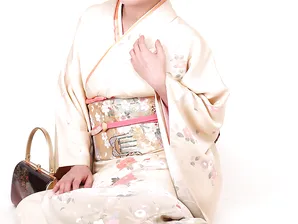 Japanese lady Ayano Murasaki receives a facial while posing in her lingerie