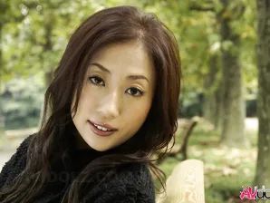 Fully clothed Japanese teen models in the park in black clothes and stockings