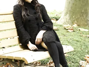 Fully clothed Japanese teen models in the park in black clothes and stockings