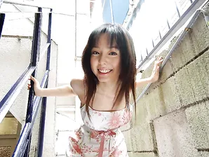 Sweet Japanese teen Yui Hasumi wears a smile while showing her hairy bush