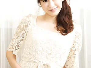 Beautiful Japanese babe unveils her natural tits and her hairy pussy