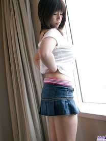 Japanese teen Haduki uncovers her great tits and hairy bush as she disrobes