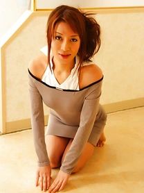 Beautiful Japanese model uncovers her great tits during solo action