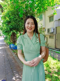 Japanese MILF Megumi Satuki shows her body and poses on a couch