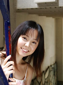 Sweet Japanese teen Yui Hasumi wears a smile while showing her hairy bush